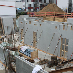 More prefabricated walls for the basement are set up…